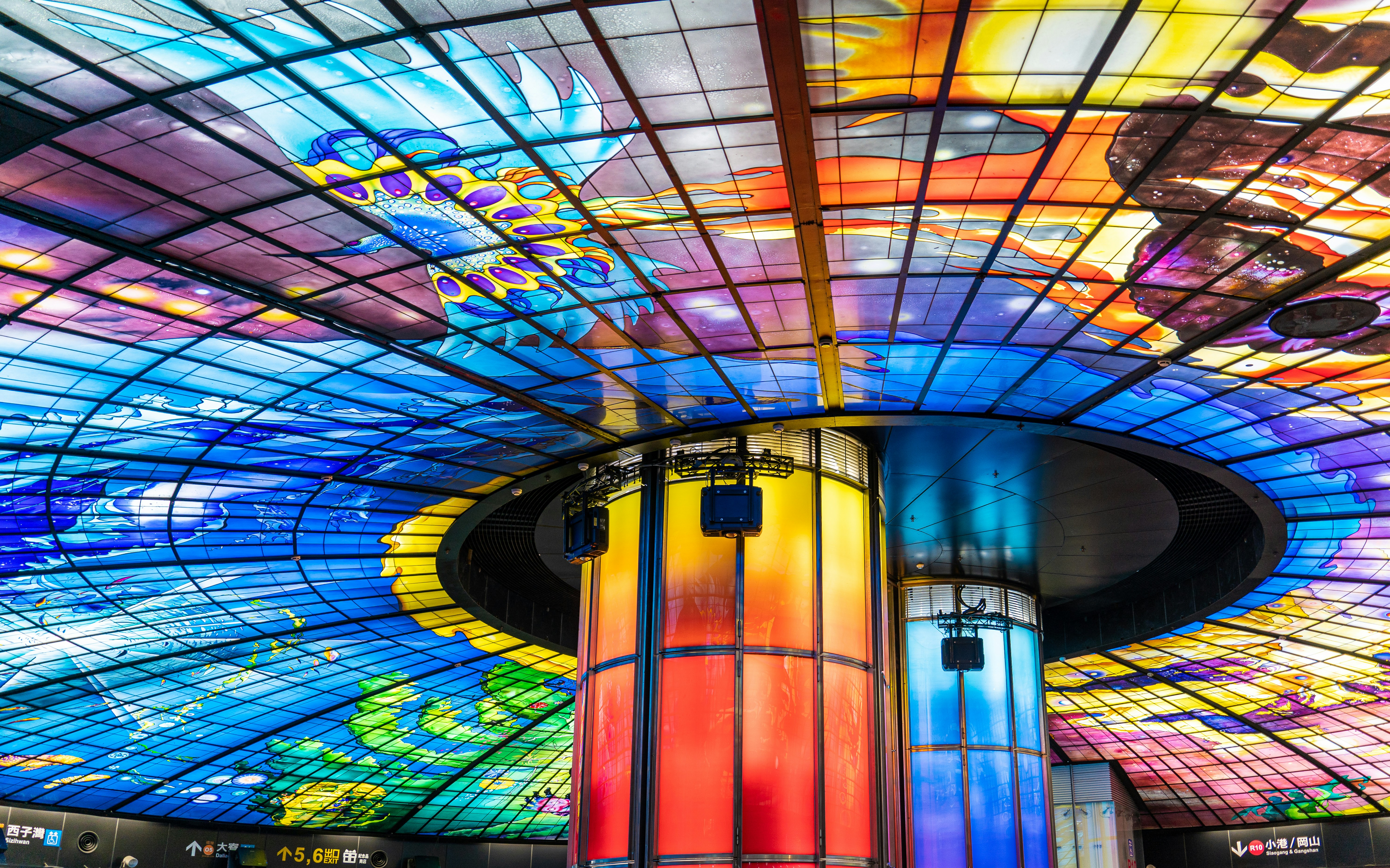 a colorful ceiling in a building with a glass ceiling