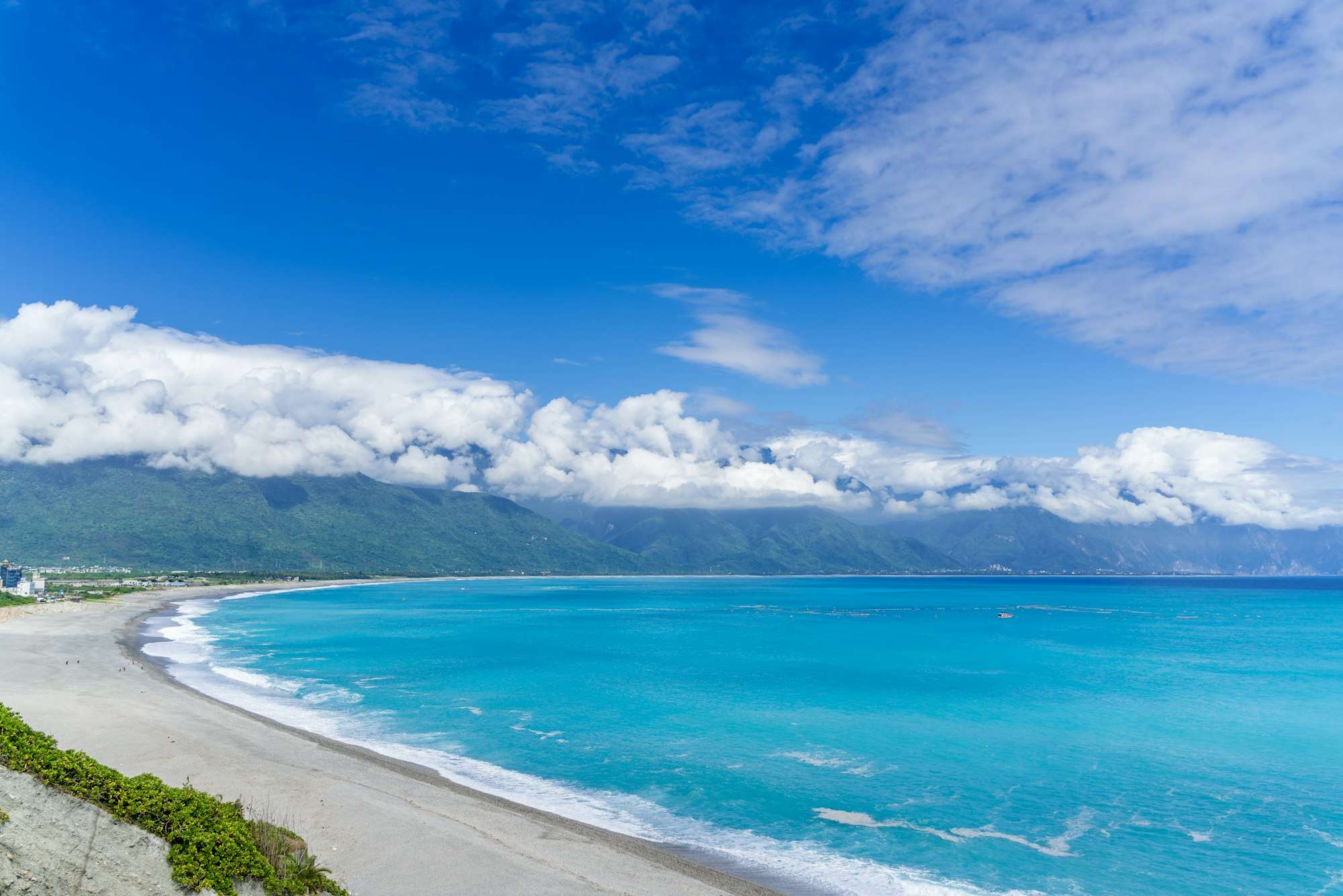blue sea under blue sky and white clouds during daytime